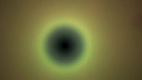 Glowing black circle with yellow aura on brown background. Stock Footage 335950029
