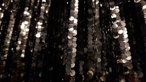 Glowing black silver sequins background with copy space Stock Photos