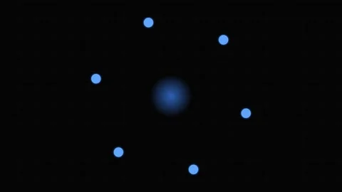 A glowing blue atom model featuring a central nucleus and orbiting particles Stock Footage 339617339