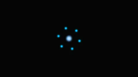 A glowing blue atom model structure isolated on a solid black background Stock Footage 339617584
