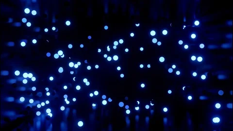Glowing blue balls flash and fly in shiny room. 4k abstract 3D background of Stock Footage 127768943