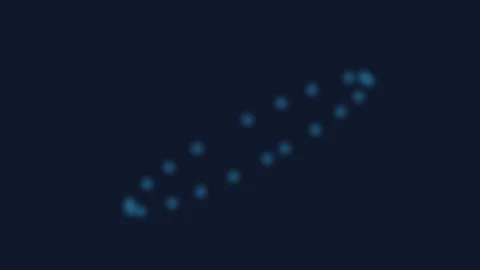 A glowing blue circle formed by small dots against a dark navy background Stock Footage 339615294