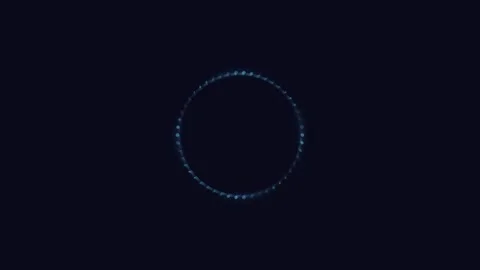 A glowing blue circle formed by tiny light particles against black background Vídeos de archivo 335145868