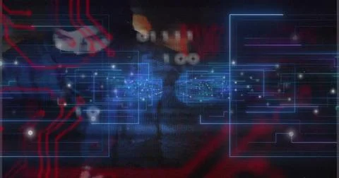Glowing blue circuit interface pulsing center in dim hardware, showing red trace Stock Photos