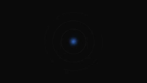 A glowing blue circular light centered in a vast field of deep black space Stock Footage 339617609
