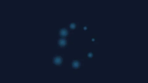 A glowing blue circular loading animation against a dark background screen 스톡 동영상 339615114