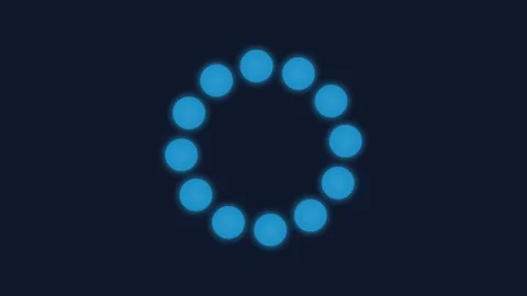 A glowing blue circular loading indicator isolated on a dark background Stock Footage 339617470