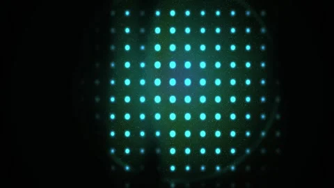 Glowing blue dots forming a circle on a black background with a grid pattern. Stock Footage 335950549