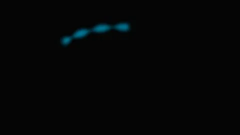 A glowing blue dotted line curving gracefully against a pitch black backgroun Stock Footage 339617388