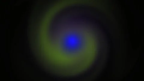 Glowing blue light in a dark background with greenish yellow rings. Stock Footage 335950789