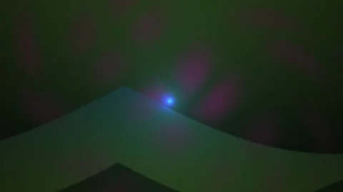 Glowing blue light on a dark background with a white object. Stock Footage 335950864