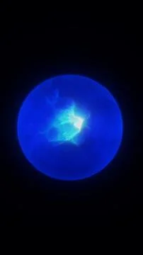 Glowing blue plasma orb on a dark background, suggesting futuristic energy,.. Illustrazione stock
