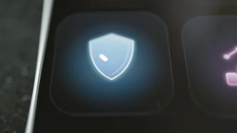 Glowing blue shield containing a white checkmark fills a single black Video stock 343371153