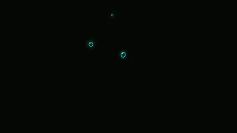 Glowing Blue Soap Bubbles Floating on Black Background Ethereal Neon Bubble Vídeos de archivo 334667798
