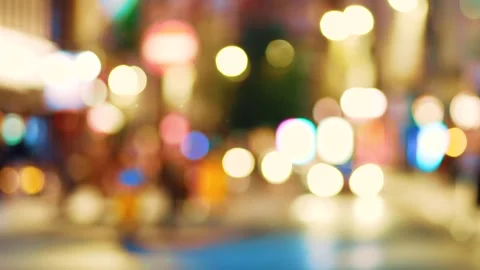 Glowing blurred cyclist riding through city street with passing cars. Soft focus Stock Footage 317327403