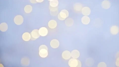 Glowing bokeh flickering on a blue background. Christmas light. Stock Footage 165068636
