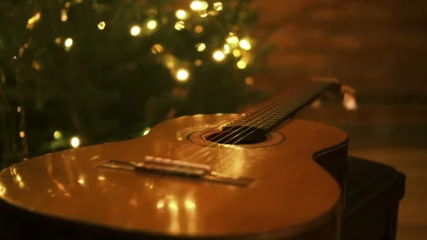 Glowing bokeh lights, a classical guitar waiting for a concert Stock-Footage 324612275
