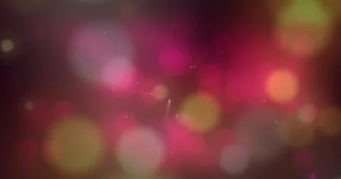 Glowing bokeh pattern forming depth across maroon backdrop, showing orbs, lens Stock Photos