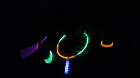 Glowing bracelets bob around glowing necklace Stock Footage 40209550