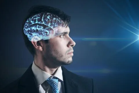 Glowing brain inside man's head. Businessman is looking in light. 스톡 사진