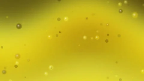 Glowing Bubble Particles Drifting on Bright Yellow Gradient Stock Footage 329374391
