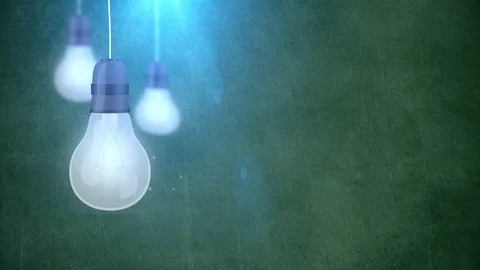 Glowing bulb bulbs falling down hanging on string green background Stock Footage 96198516