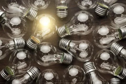 Glowing bulb uniqueness concept Stock Photos