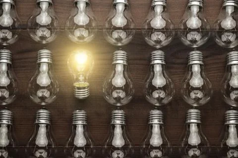 Glowing bulb uniqueness concept Stock Photos