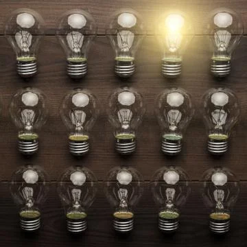 Glowing bulb uniqueness concept Stock Photos