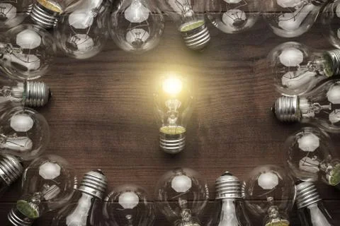 Glowing bulb uniqueness concept Stock Photos