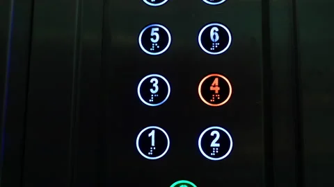 Glowing buttons in the elevator, a red button with the number four, the elevator Stock Footage 237470867