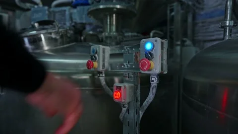 Glowing buttons on the production line Stock Footage 239860140