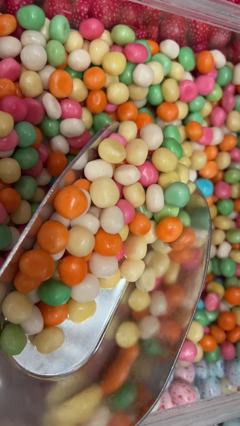 Glowing Candy Beans Pour Into Pile 2 Shots Stock Footage 316048757