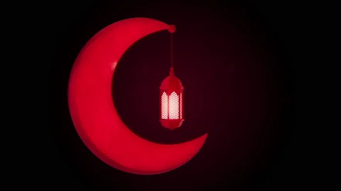 Glowing celebration lantern hanging in moon on dark background. Stock Footage 105285403