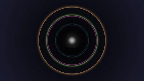 A glowing celestial light orb surrounded by concentric rings in deep space 库存影片 335117772