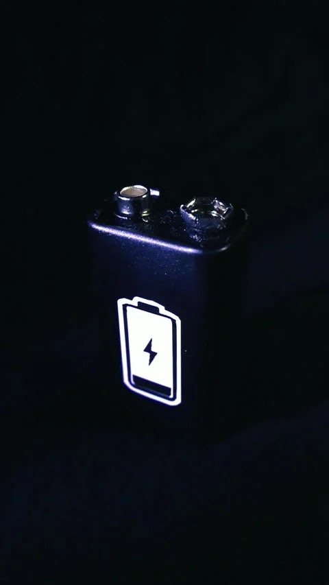 Glowing Charging Icon on a 9 Volt Battery Stock Footage 338993164