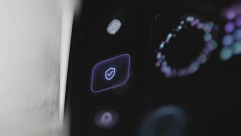 Glowing check shield button is selected beside a ring of colored orbital Stock Footage 343377693