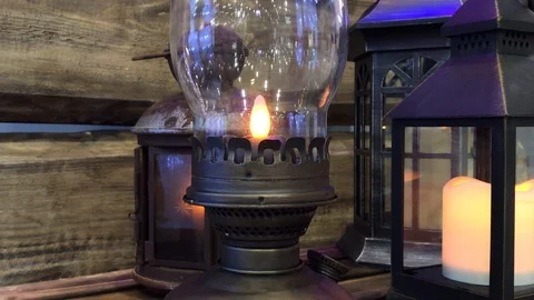 Glowing Christmas lantern with wick light in a wooden place Stock Footage 97771987