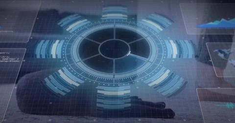 Glowing circular holographic interface spanning reflective desk at tech 库存照片