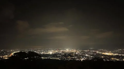 Glowing City Lights Seen from the Summit Timelapse Stock Footage 336666887