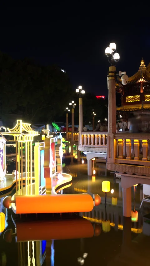 Glowing clock lantern and Huxinting Pavilion at night in SHANGHAI China Stock Footage 344951114