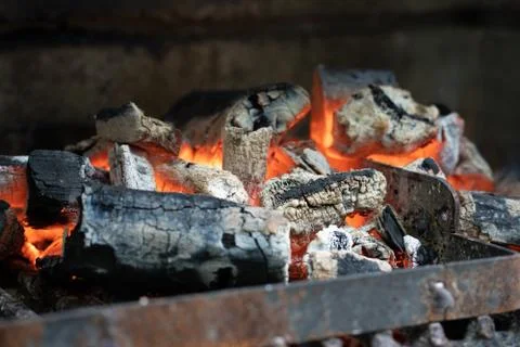 Glowing coal during a barbeque in summer Stock Photos