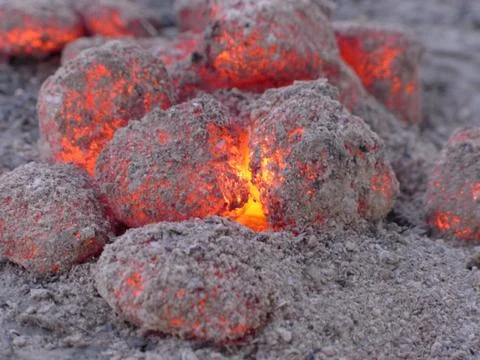 Glowing coal pieces Stock Photos