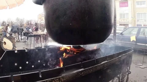 Glowing Coals is Heated Iron Cauldron Over Them Close-Up Stock Footage 74793685