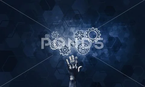 Glowing cogwheel mechanism icon on dark background as symbol of Stock Photos