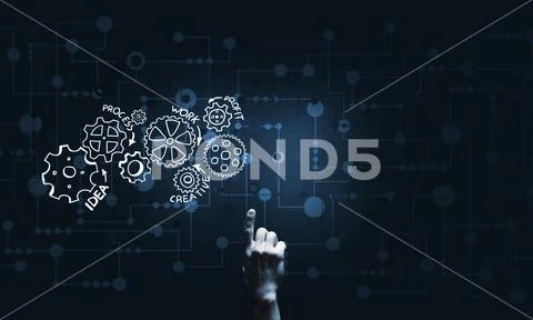 Glowing cogwheel mechanism icon on dark background as symbol of teamwork Stock Photos