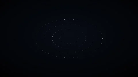 Glowing concentric rings of small light particles rotating smoothly on a da.. 库存影片 347816165