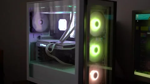 Glowing coolers on gaming PC in a dark room. Stock Footage 313819481