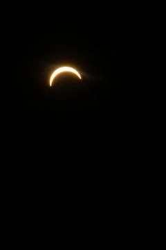 Glowing crescent of the sun captured during a partial solar eclipse Stock Photos