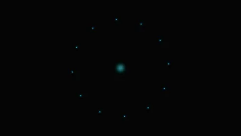 A glowing cyan center point surrounded by a ring of small light particles Stock Footage 339615902